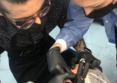 Microblading student working on live model